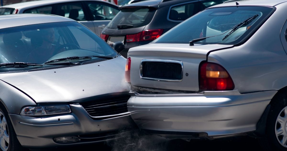 Many broken cars after a traffic accident in the parking lot of a